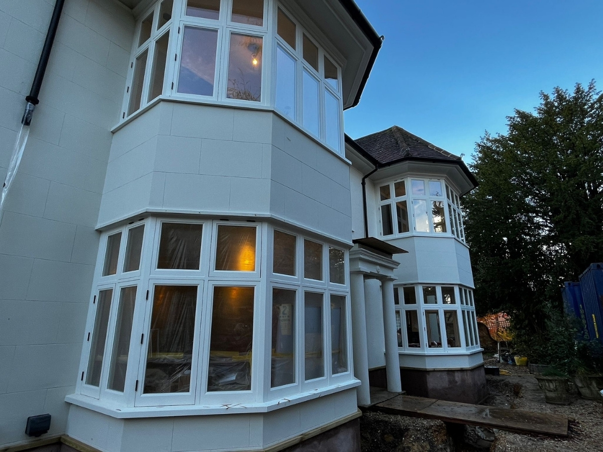 Warm and energy-efficient solid wall house after retrofit at dusk